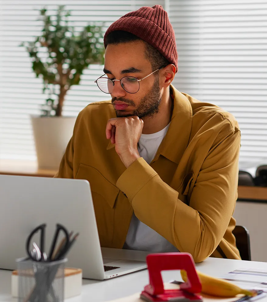 A person reviewing work on a laptop