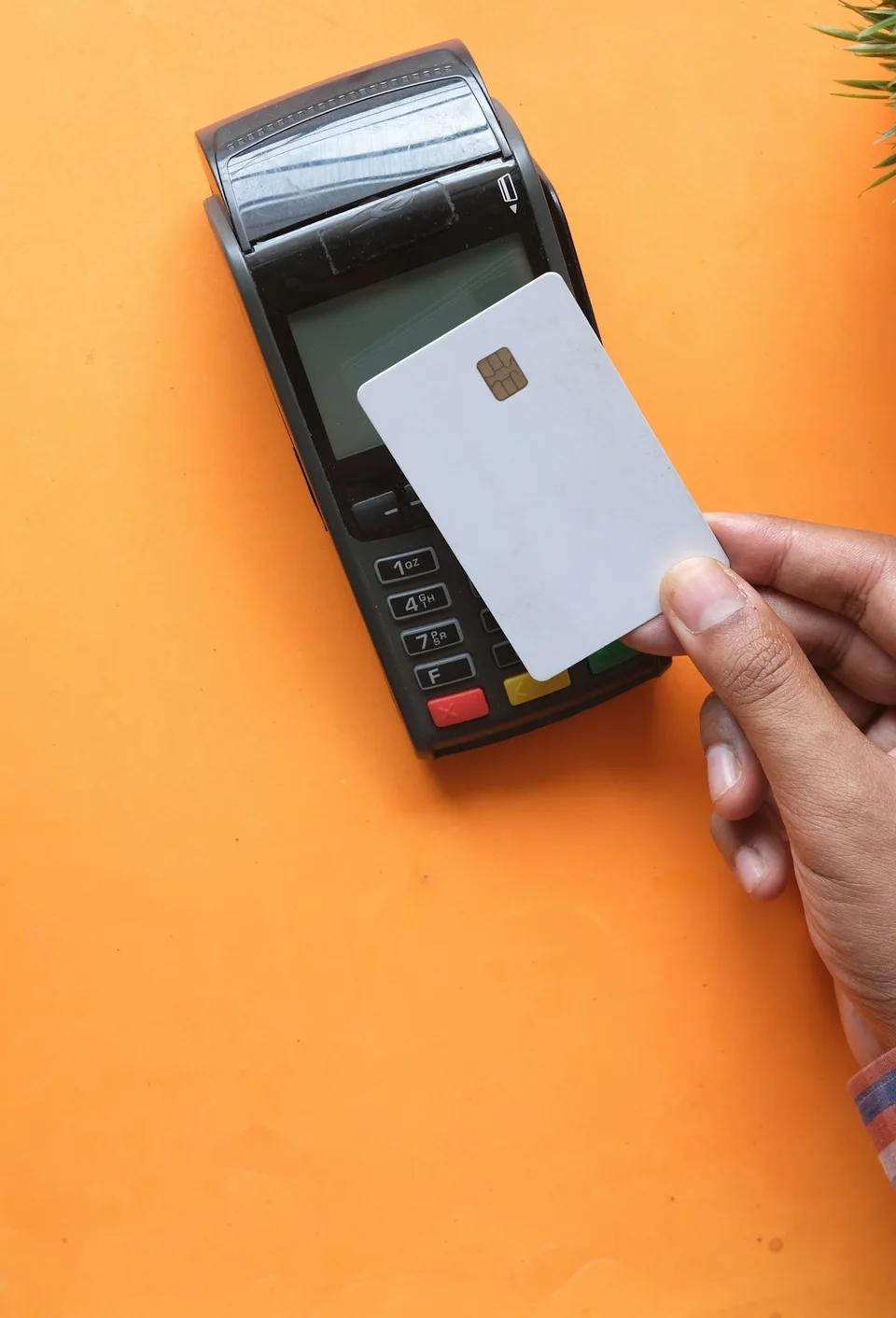 Card held to a contactless payment terminal