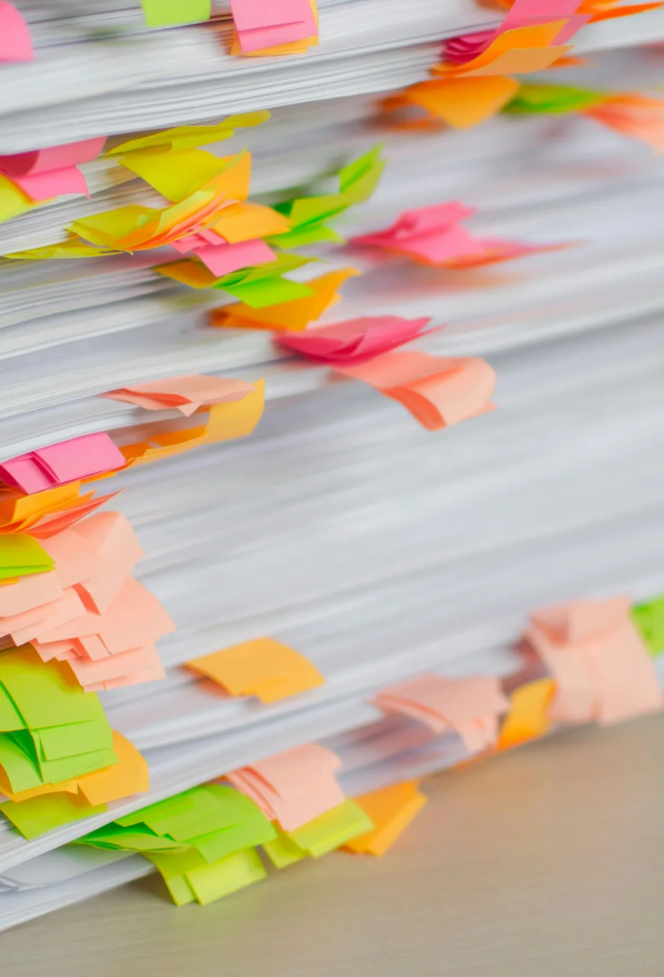 Stack of documents marked with colored tabs